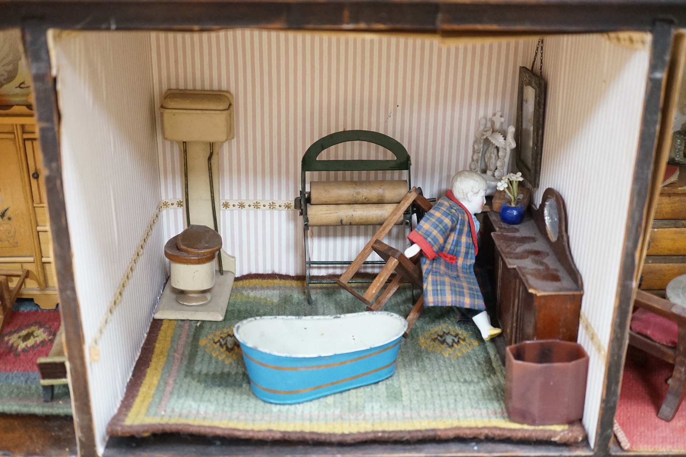 A furnished English dolls’ house, circa 1810-20, 104cm high